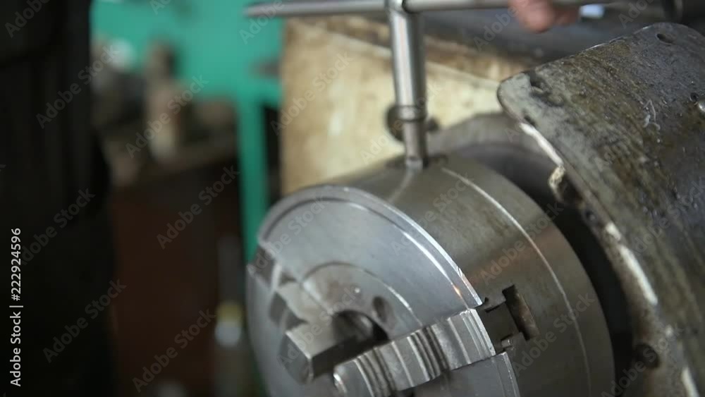 a worker working on a lathe a worker working on a lathe