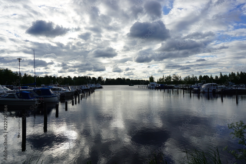 Fototapeta premium Scenic clouds over a lake in Finland