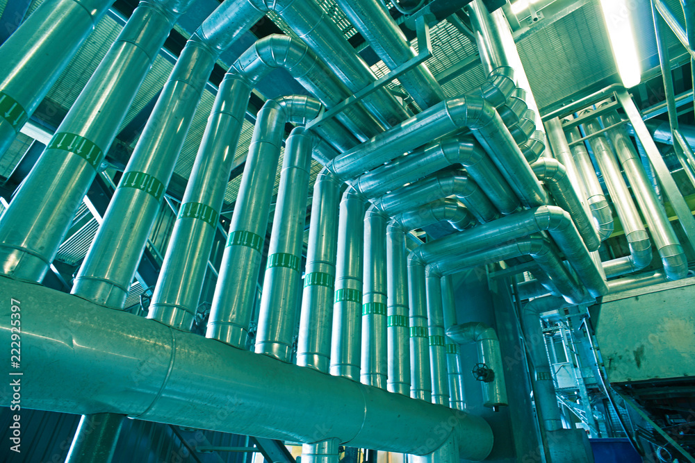 Obraz premium Industrial Steel pipelines, valves, cables and walkways