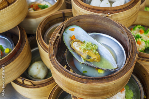 Mussel With Seafood Sauce in Various Dim Sum on the Table, Steamed Traditional Chinese Cuisine Food photo