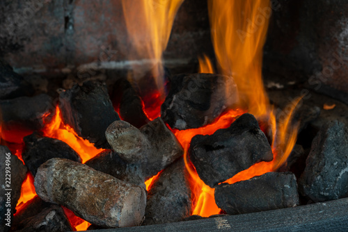 Close of burning firewood in the fireplace.