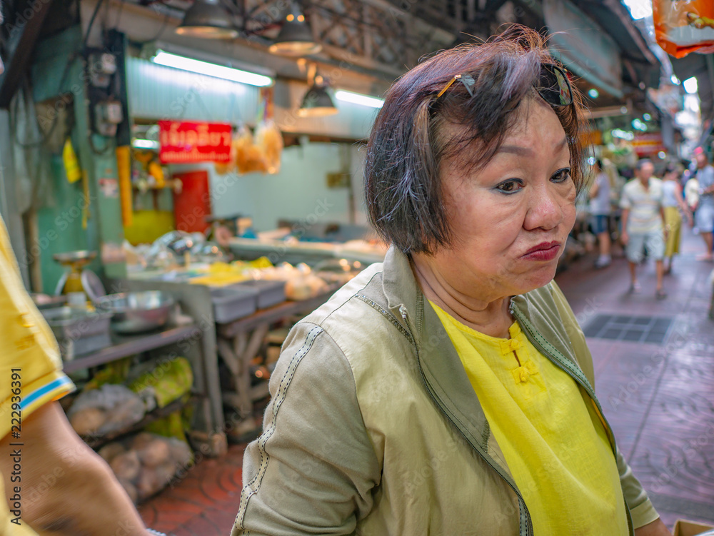 Beauty asian old women very happy in down town of bangkok china town in bangkok city thailand,thailand travel