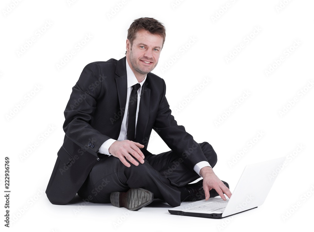 businessman with laptop sitting on the floor. businessman with laptop sitting on the floor.