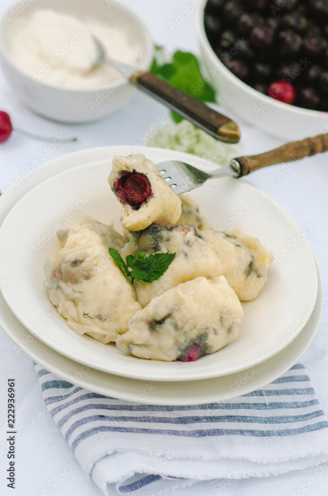 Homemade traditional Russian Ukrainian dumplings, vareniki with cherries Homemade traditional Russian Ukrainian dumplings, vareniki with cherries