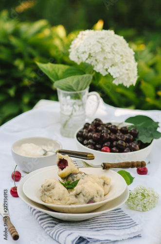 Homemade traditional Russian Ukrainian dumplings, vareniki with cherries