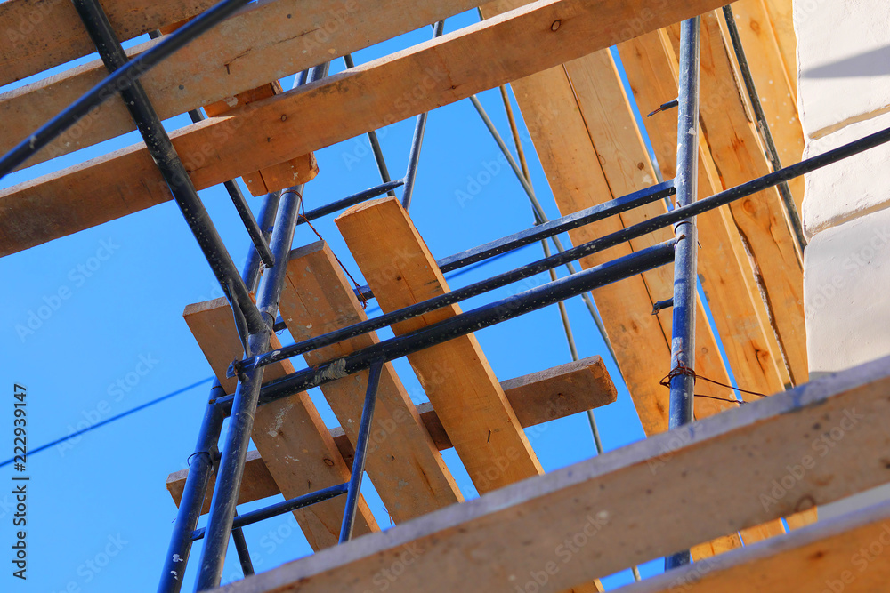 fragment of extensive pipe scaffolding on a building fragment of extensive pipe scaffolding on a building