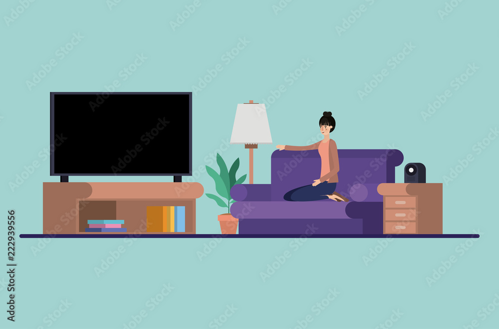 young woman watching tv on the livingroom young woman watching tv on the livingroom