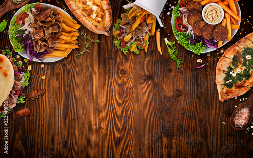 Top down view on traditional turkish meals on vintage wooden table.