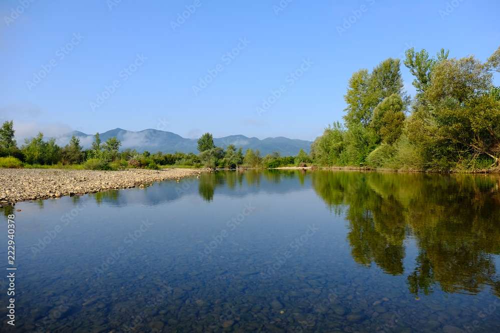 beautiful transparent river on a background of mountains