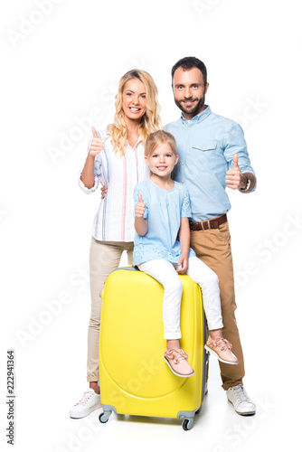 family with yellow suitcases showing thumbs up isolated on white