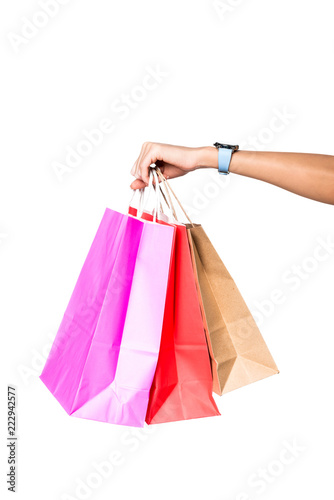 woman holding shopping bags isolated on white