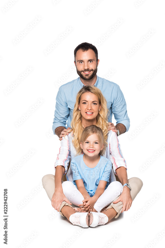 smiling parents with daughter looking at camera isolated on white smiling parents with daughter looking at camera isolated on white