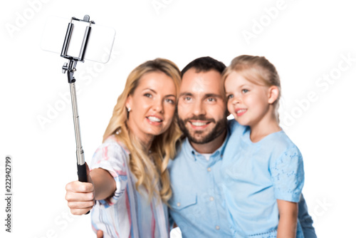 happy family taking selfie isolated on white © LIGHTFIELD STUDIOS