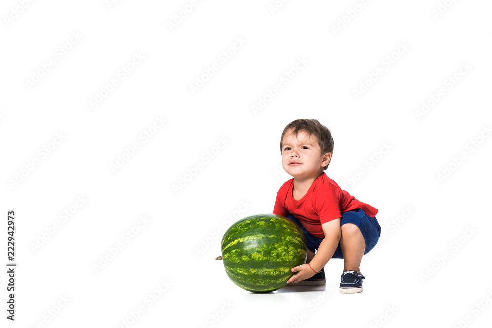 kid trying to raise watermelon isolated on white kid trying to raise watermelon isolated on white