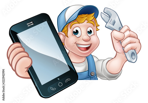 A plumber, mechanic or handyman holding a spanner and phone with copyspace