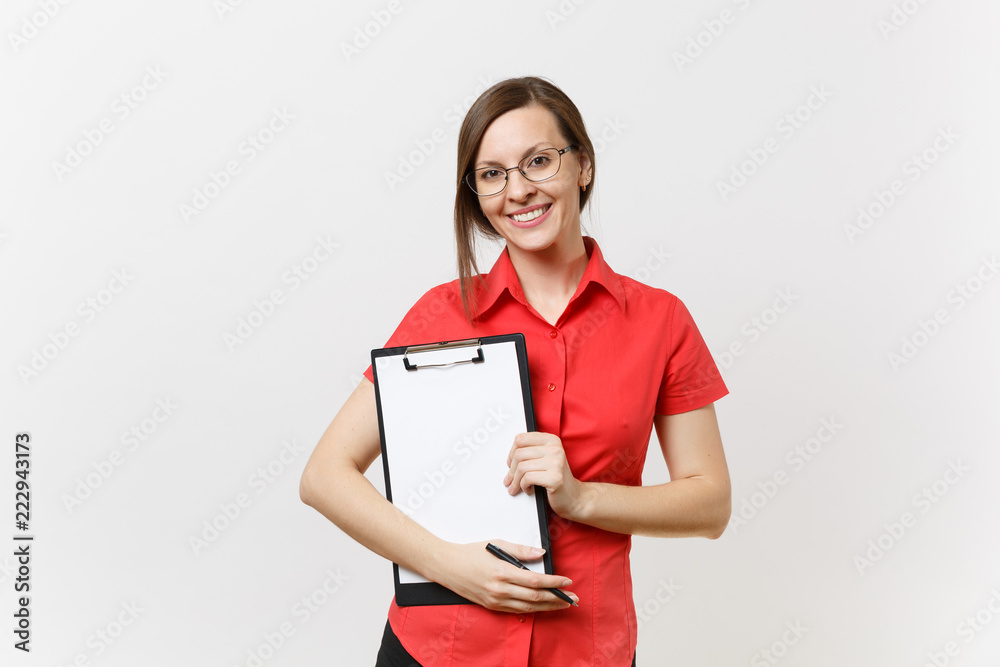 Portrait of young business teacher woman in red shirt, glasses holding pen clipboard with blank empty paper documents isolated on white background. Education teaching in high school university concept Portrait of young business teacher woman in red shirt, glasses holding pen clipboard with blank empty paper documents isolated on white background. Education teaching in high school university concept