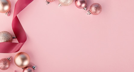 Pink baubles in row on pink