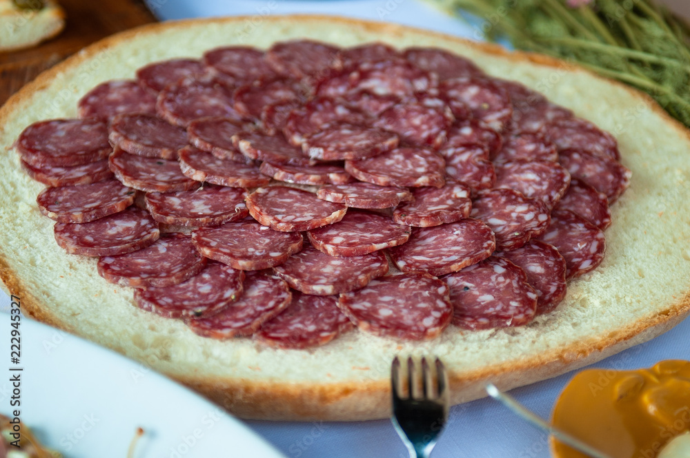 Genuine Italian salami as an appetizer at a party