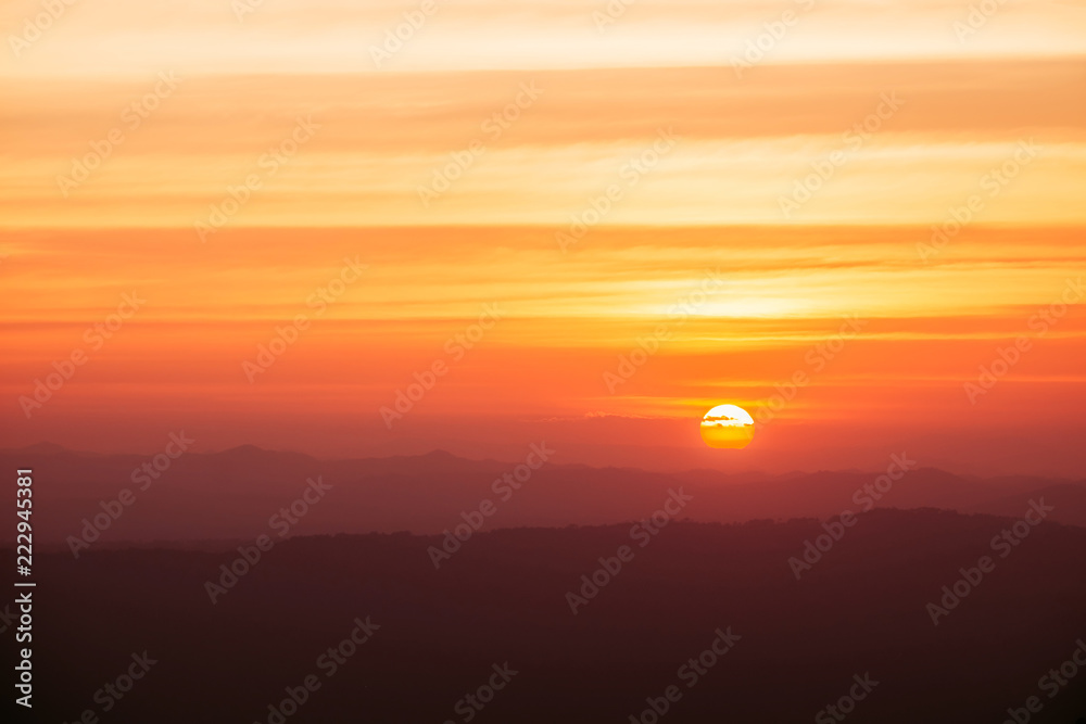 Dramatic sunset and sunrise over mountain morning twilight evening sky.