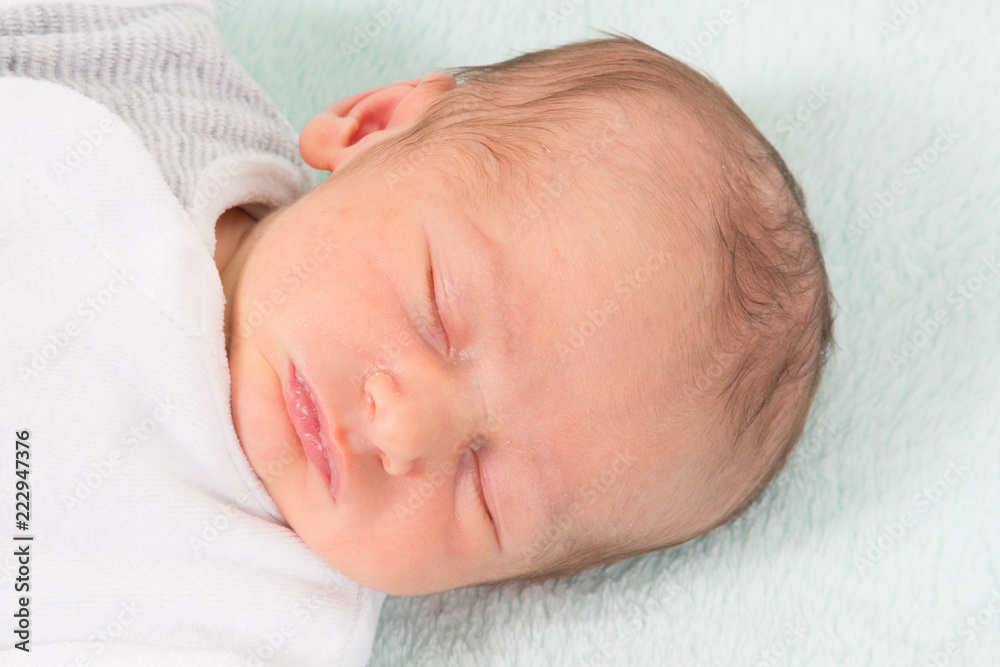 close up portrait baby newborn sleeping in bed close up portrait baby newborn sleeping in bed