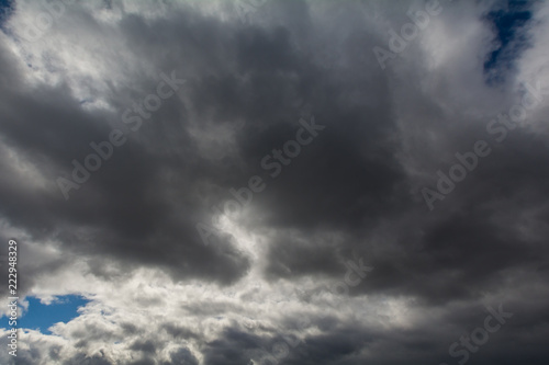 The sky covered with gray, heavy clouds.