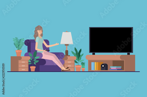 young woman watching tv on the livingroom