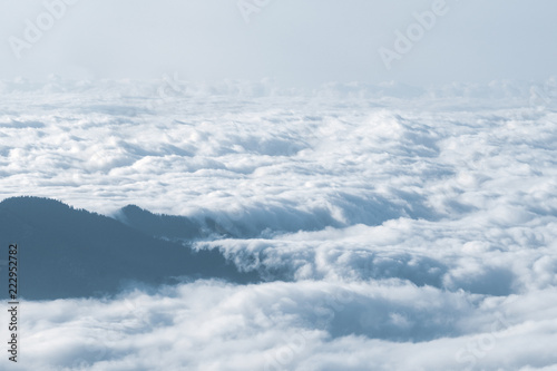 Beautiful aerial view with mountains and white clouds.