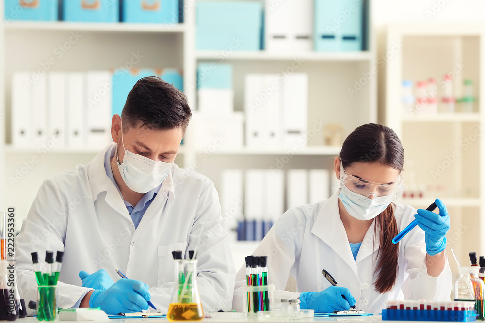 Scientists working in laboratory Scientists working in laboratory