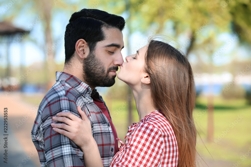 Fototapeta premium Happy young couple in park on spring day