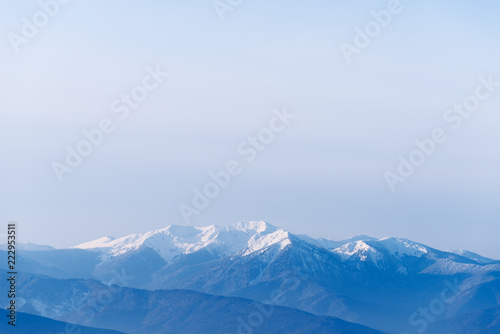 Winter landscape with mountain tops in the snow © Oleksandr Kotenko