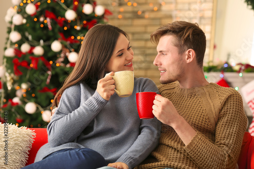 Cute young couple drinking ...