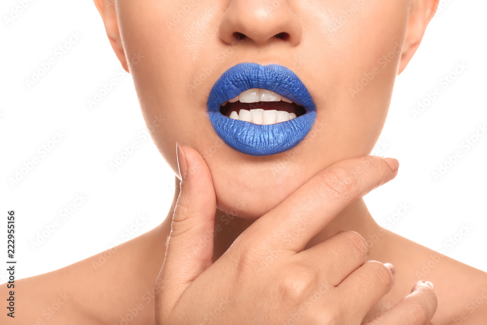 Obraz premium Beautiful young woman with unusual lipstick on white background, closeup