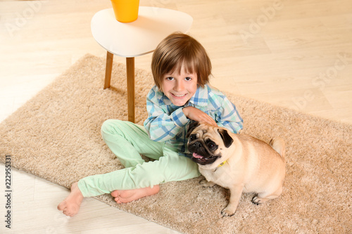 Little boy sitting with cut...