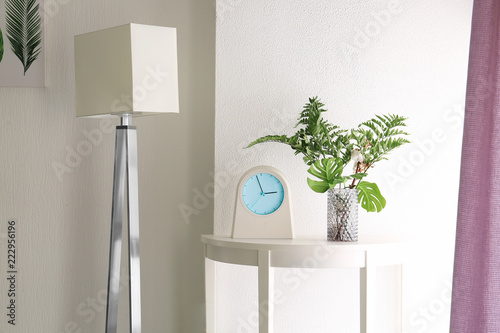 Tropical leaves in vase wit...