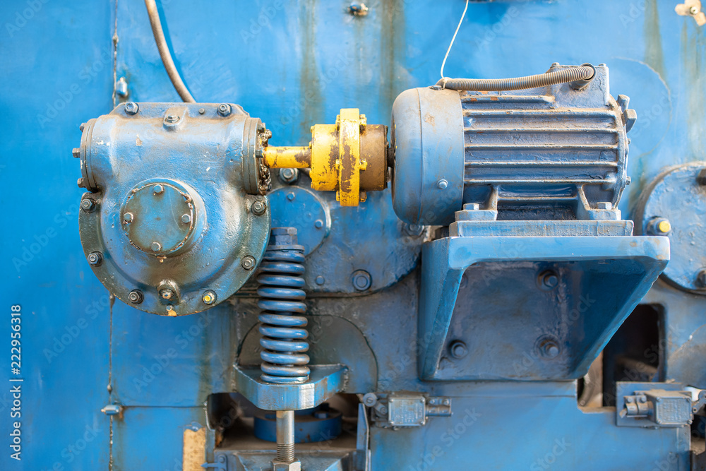 Part of a machine. Close up blue machine motor.