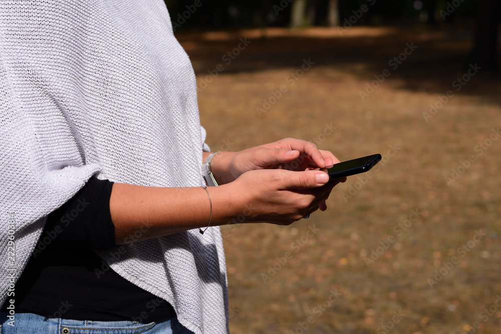 Beautiful young woman using a mobile