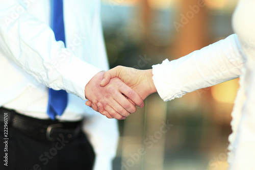closeup .the handshake of a businessman and business woman. © yurolaitsalbert