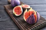 Fresh ripe figs on wooden board