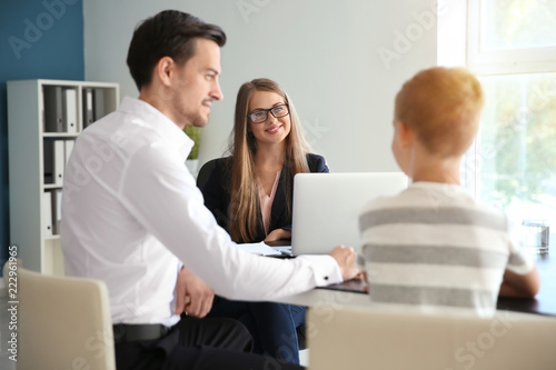 Fotografie Young man and his son meeting with headmistress at school