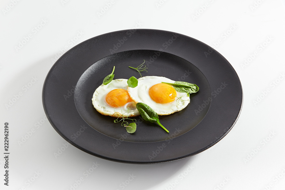 Fried Eggs Decorated with Fresh Spinach Leaves and Young Pea Shoots Fried Eggs Decorated with Fresh Spinach Leaves and Young Pea Shoots