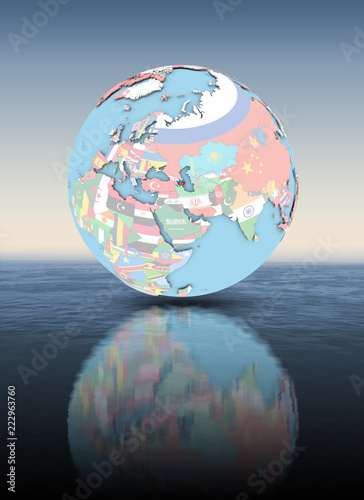 Azerbaijan on globe with flags above water surface