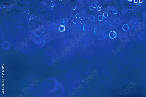 background bokeh blue rings / texture blurred background defocusing blue abstract