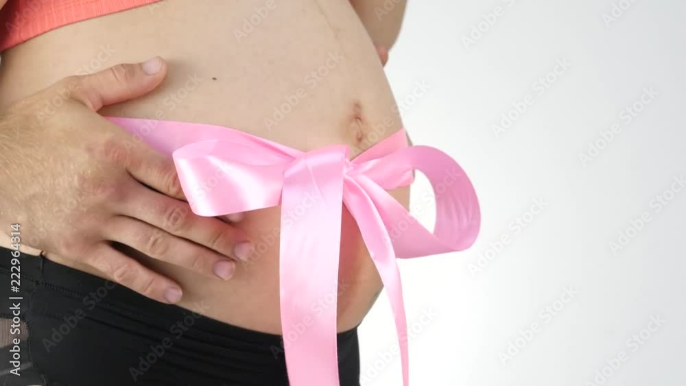 Man's hands embrace a belly of the pregnant woman. 4K Man's hands embrace a belly of the pregnant woman. 4K