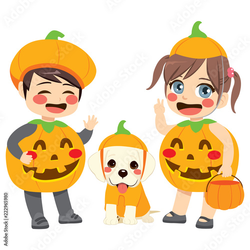 Cute little kids and dog pet wearing pumpkin costumes for Halloween celebration party