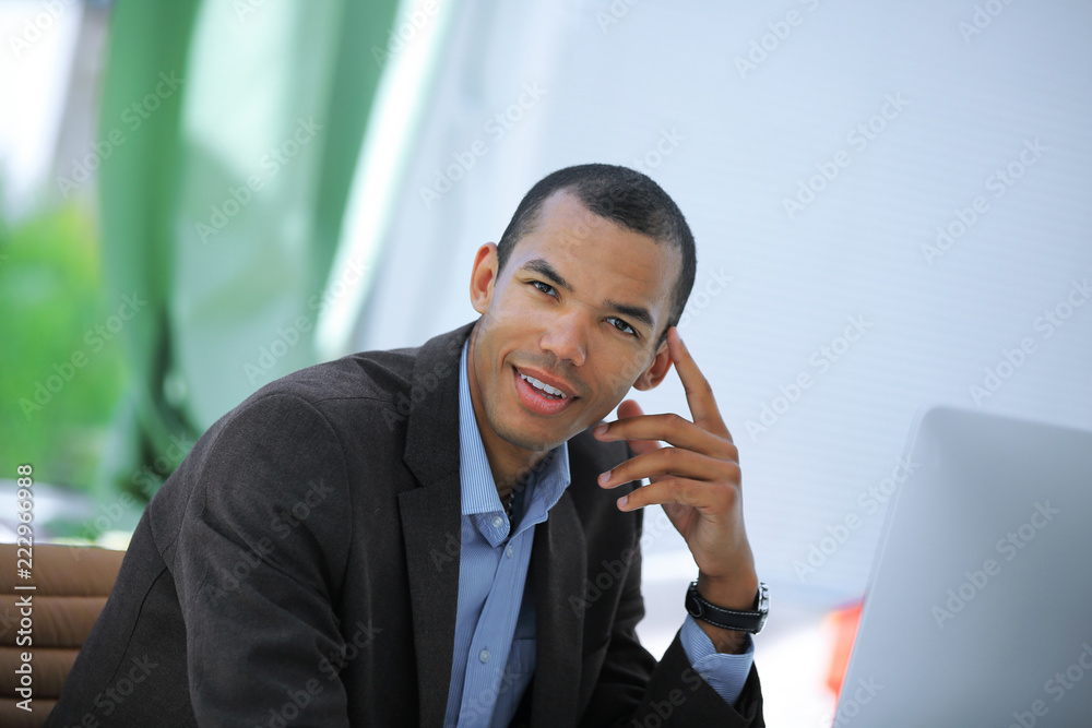 portrait of a handsome businessman on a workplace portrait of a handsome businessman on a workplace