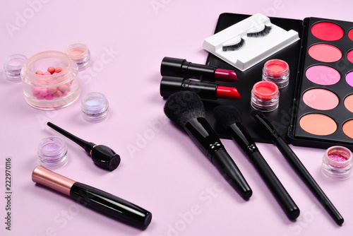 Professional makeup products with cosmetic beauty products, blushes, eye liner, eye lashes, brushes and tools.