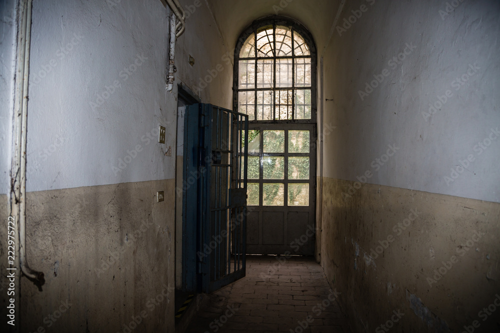 Long Corridor and White and Worn Walls of a Prison Long Corridor and White and Worn Walls of a Prison