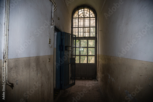 Long Corridor and White and Worn Walls of a Prison