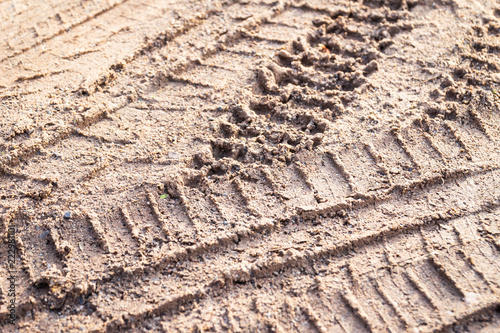 motorcycle tire track print on sand with selective focus