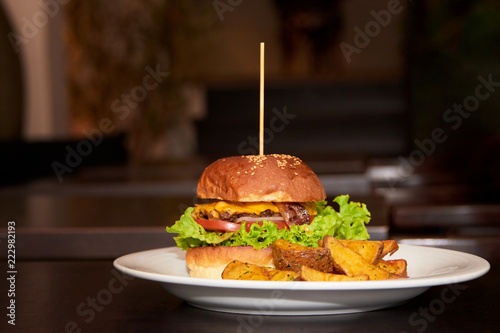 Burger with wedges potatoes